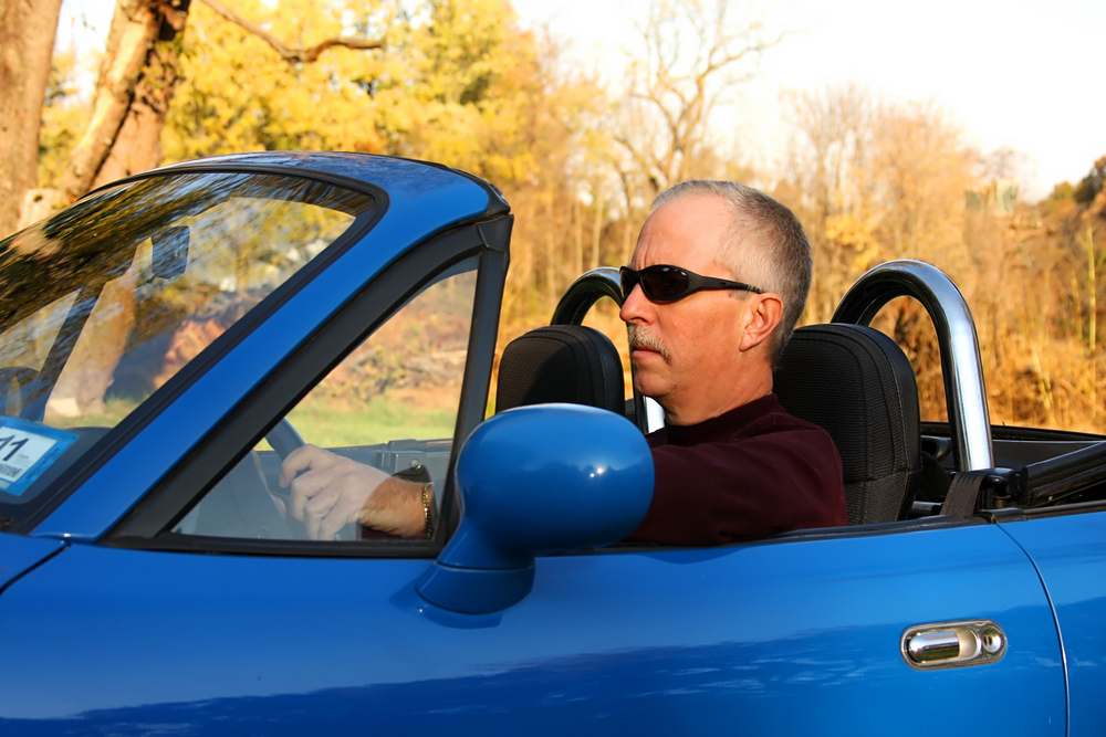 UNLIMITED-COVID-societys-ageless-mid-life-crisis-blue-car
